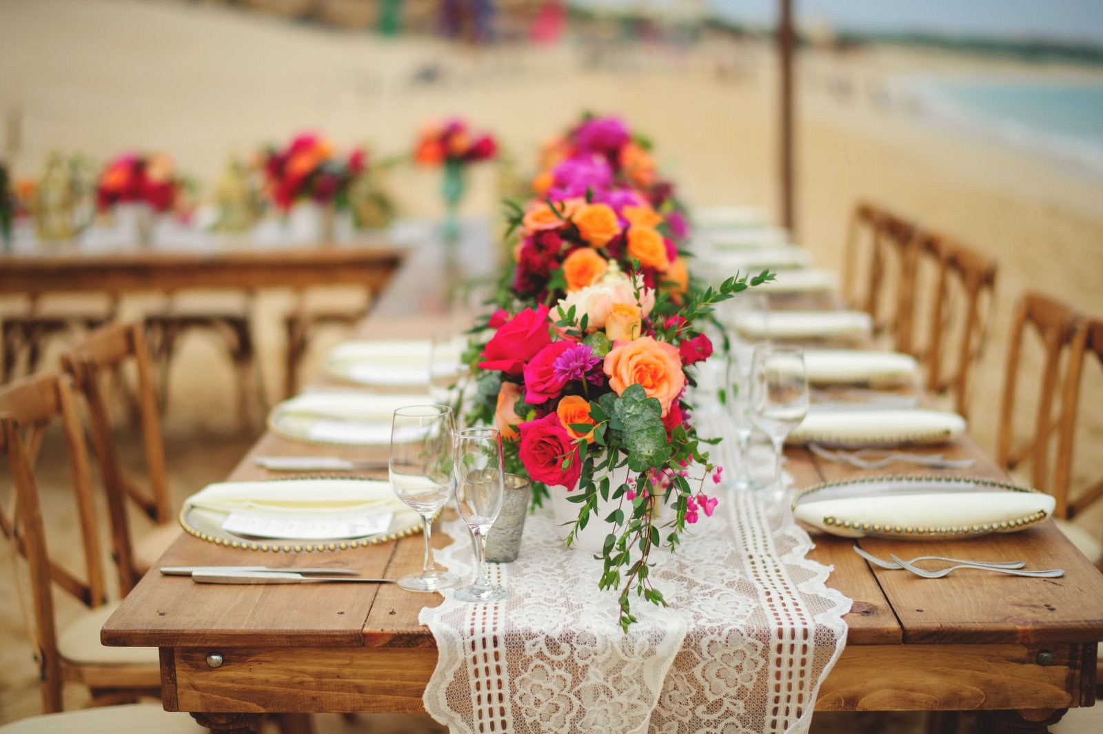 Reception Wedding and design by Cabo Wedding Services at Villa la Estancia in Cabo San Lucas. Table arrangements with Peonies and Roses