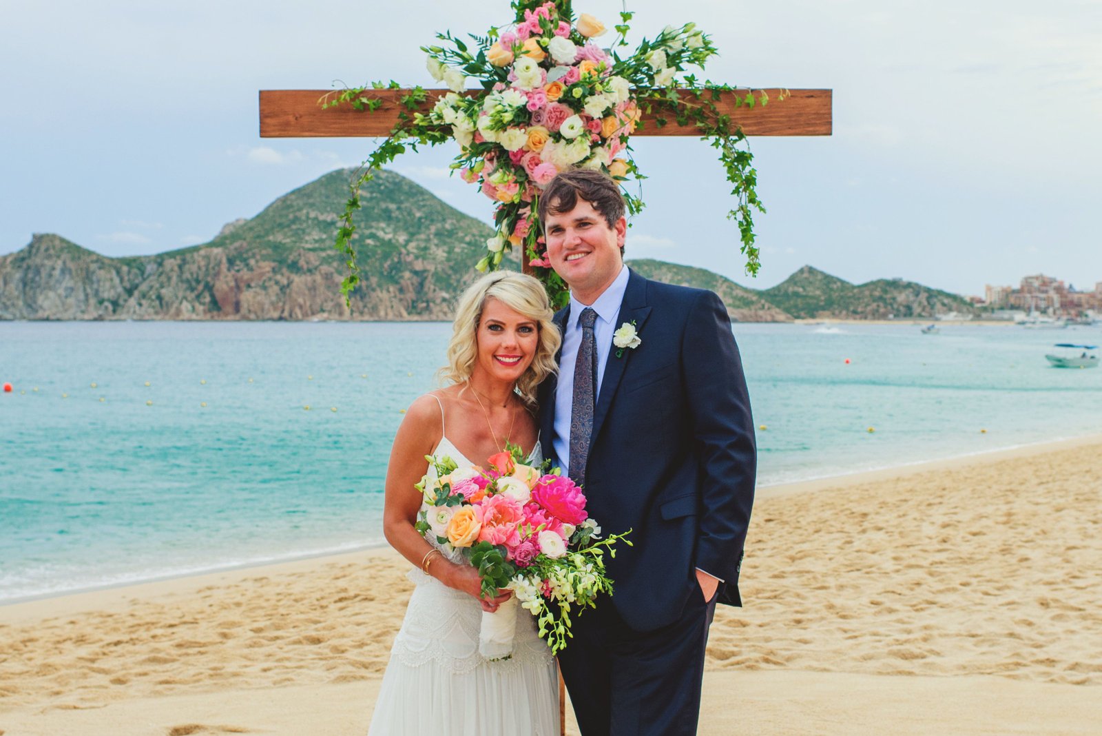 Bride and groom after wedding ceremony. design by Cabo Wedding services at Villa la Estancia