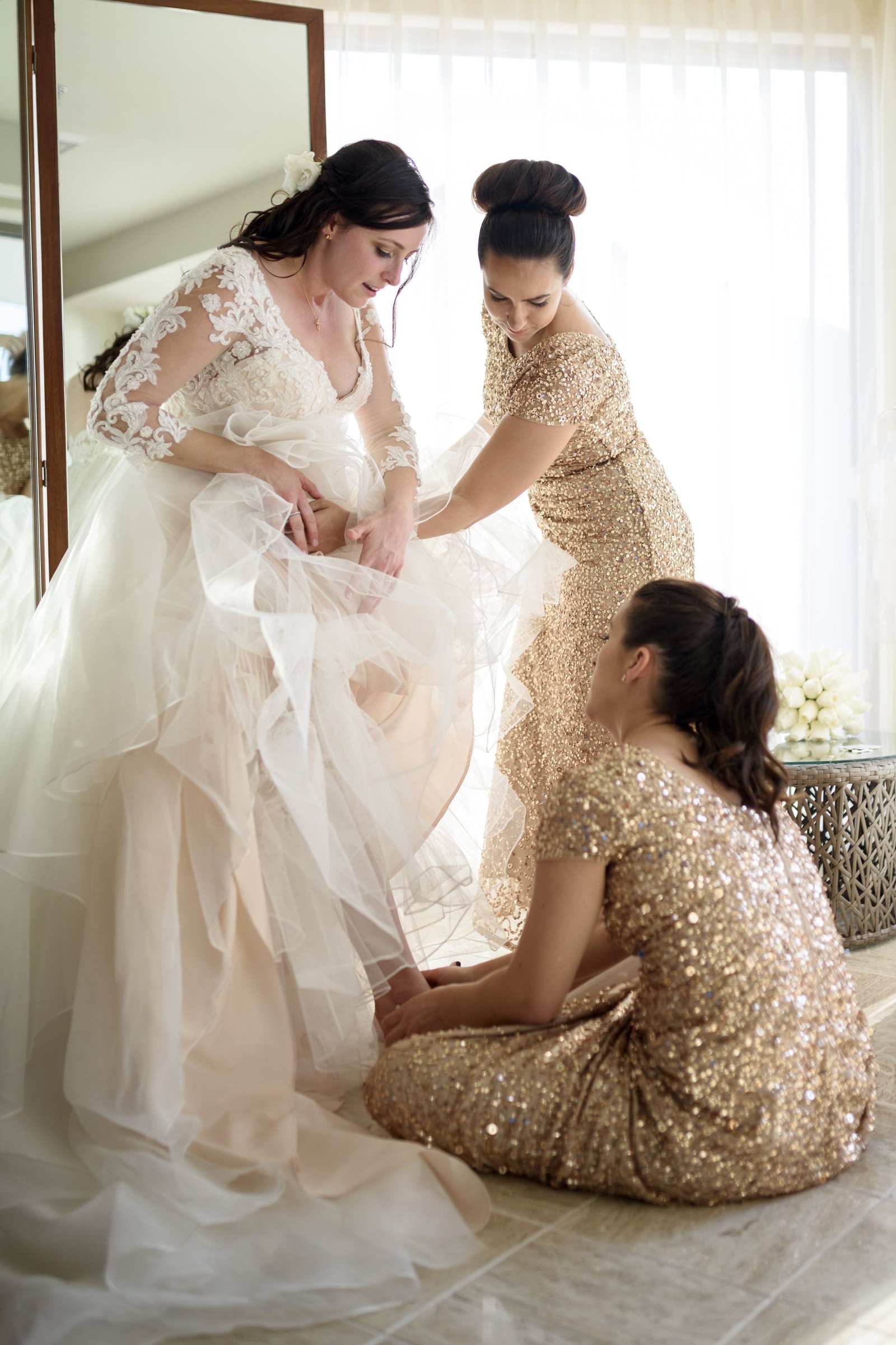 Bridesmaids helping Bride get ready for her wedding ceremony at the Hyatt Ziva in Puerto Vallarta
