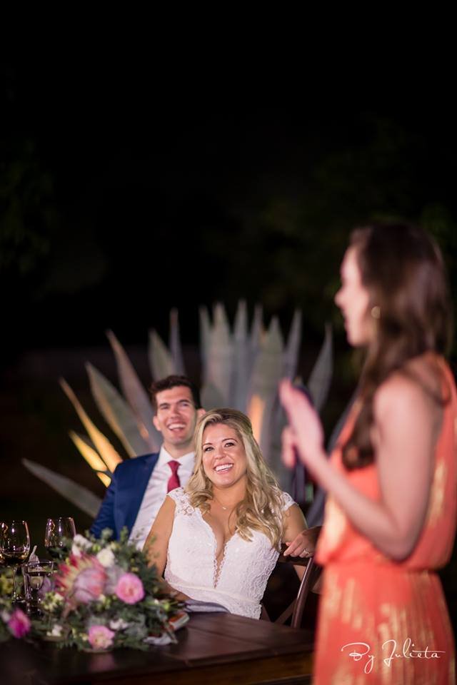 Bridesmaid giving speach to Bride and Groom on their wedding day at Acre Baja designed by Jesse Wolff and coordinated by Cabo Wedding Services