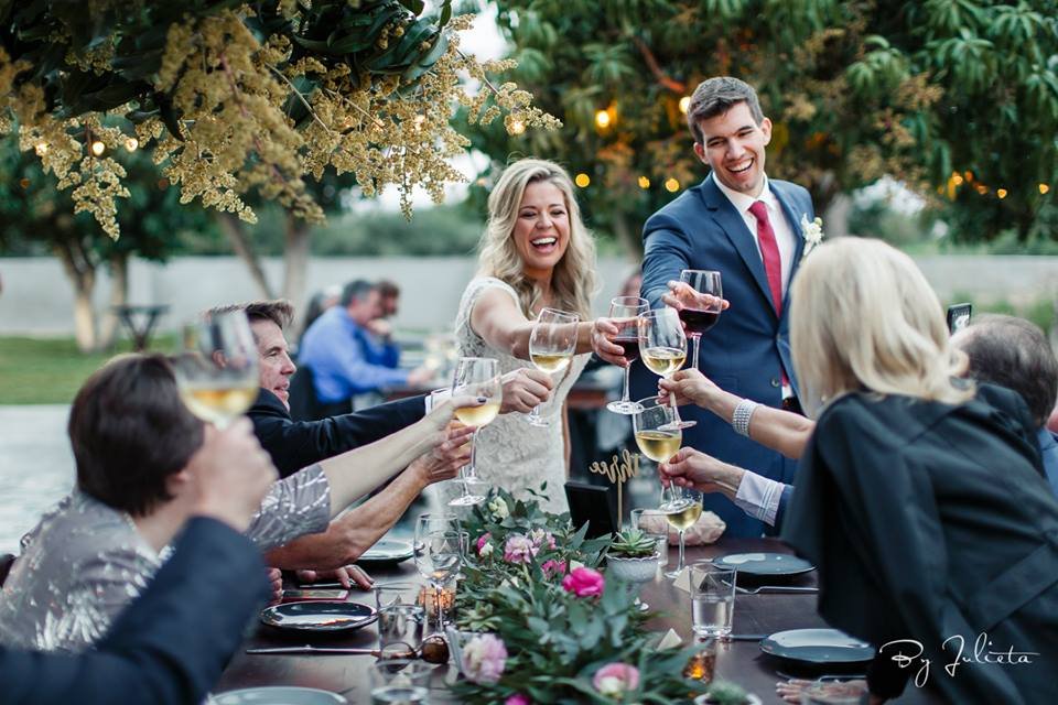 Bride and Groom having a drink with their guests at Acre Baja in Los Cabos by Cabo Wedding Services