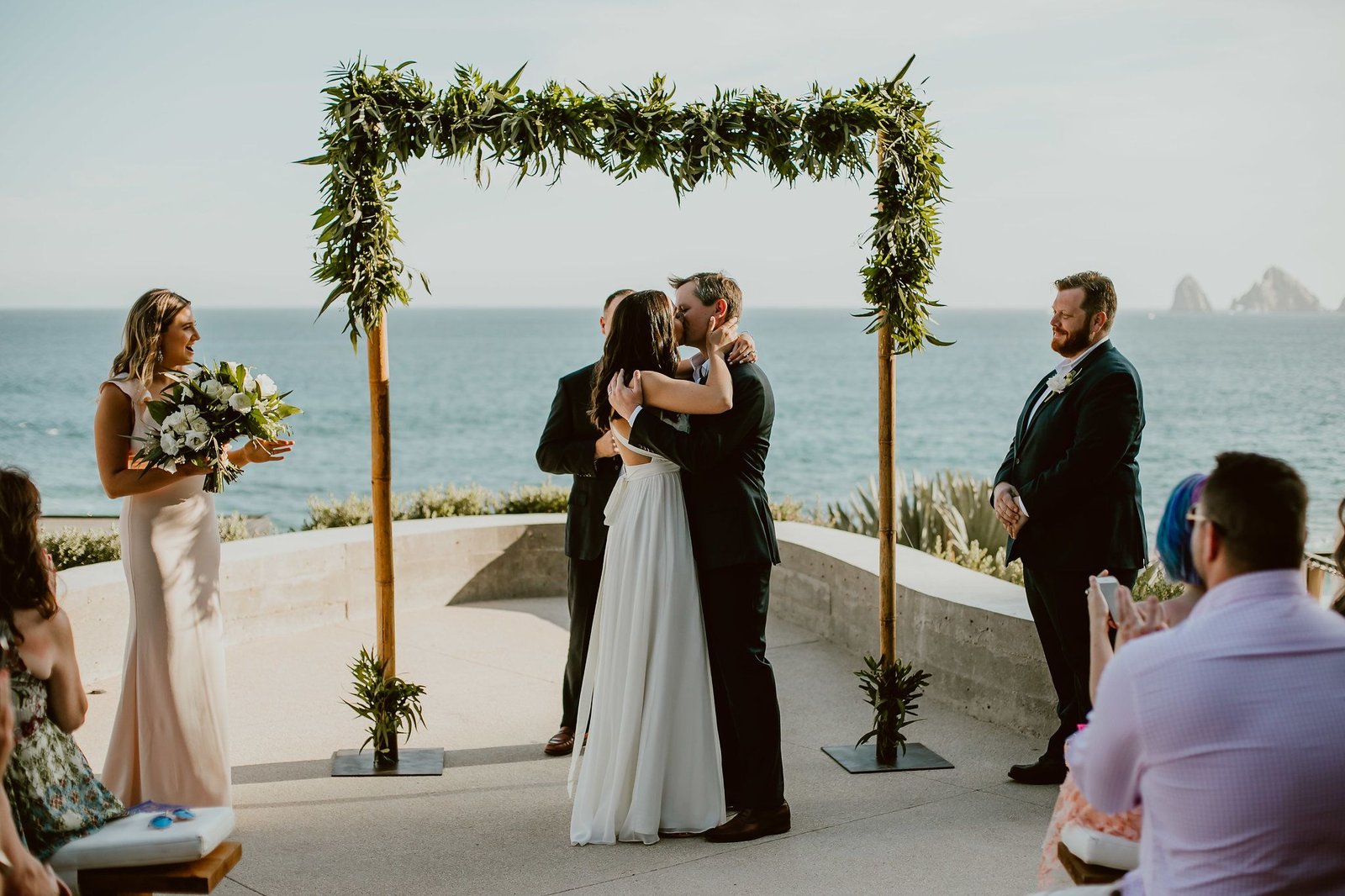 Bride and Groom kissing after Wedding Ceremony at The Cape in Los Cabos Mexico