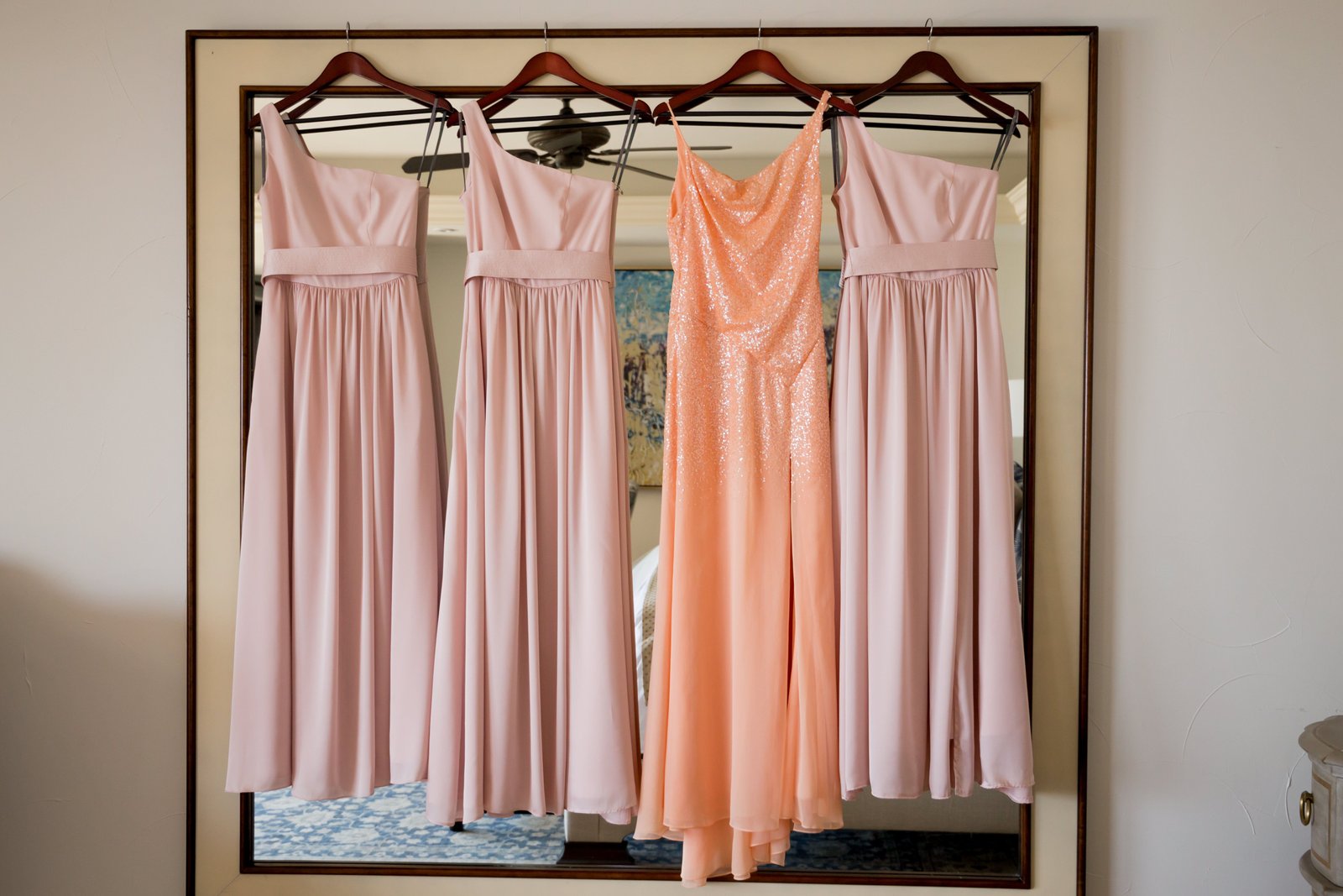 Bridesmaid dresses hanging up before wedding ceremony. My bride decided to go with pastel colors because the Villa had such neutral colors, they contrasted perfectly