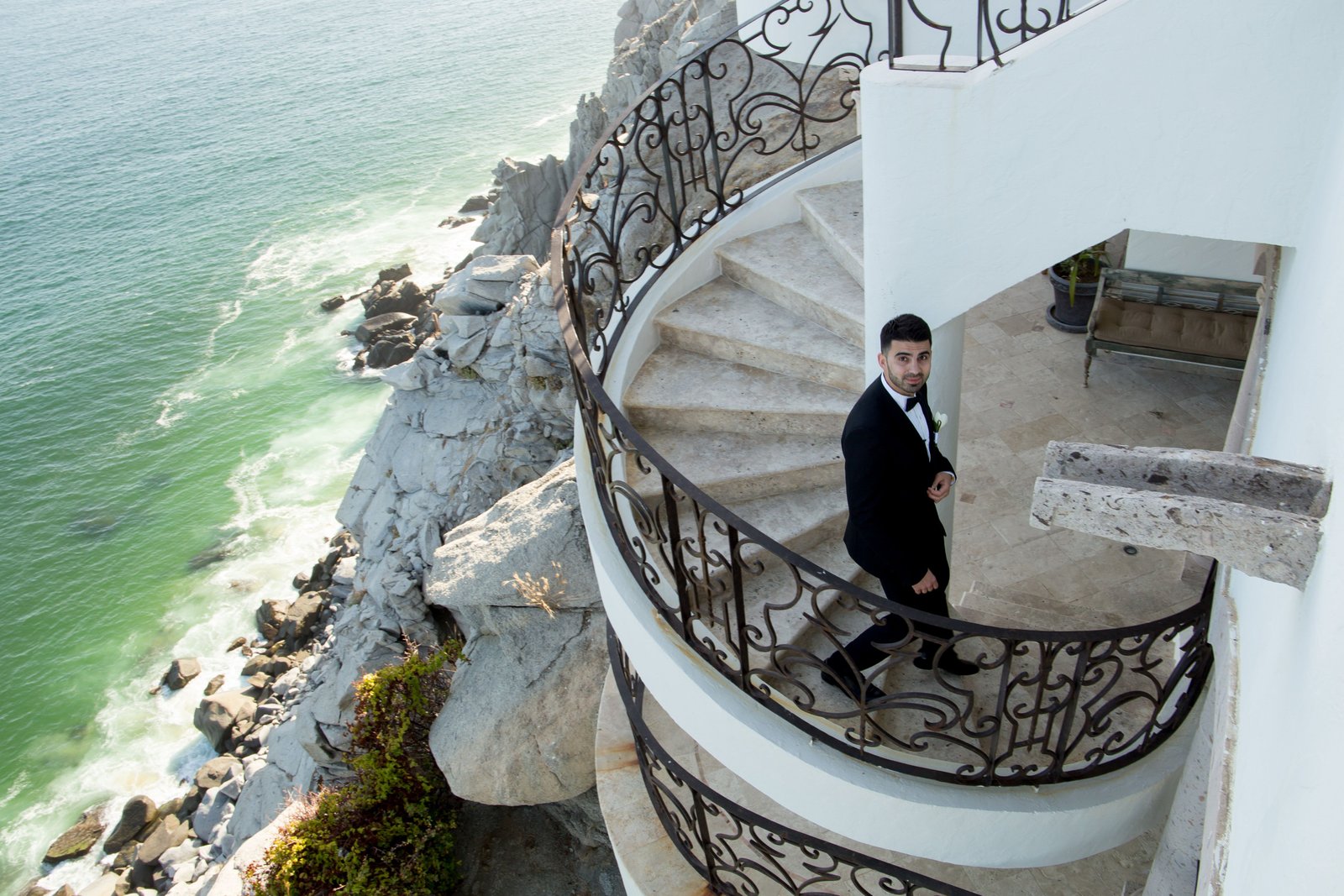 Groom walking down to the ceremony at Villa la Roca Los cabos