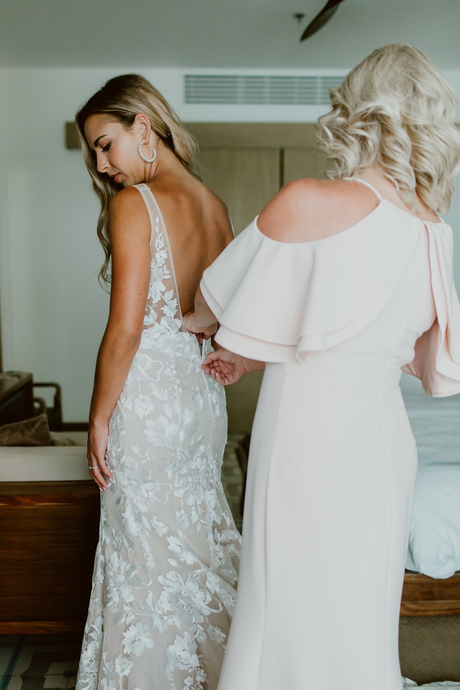 Brides mom, Debbie assisting Dana the Bride in putting on her dress. This is always a great photo! 