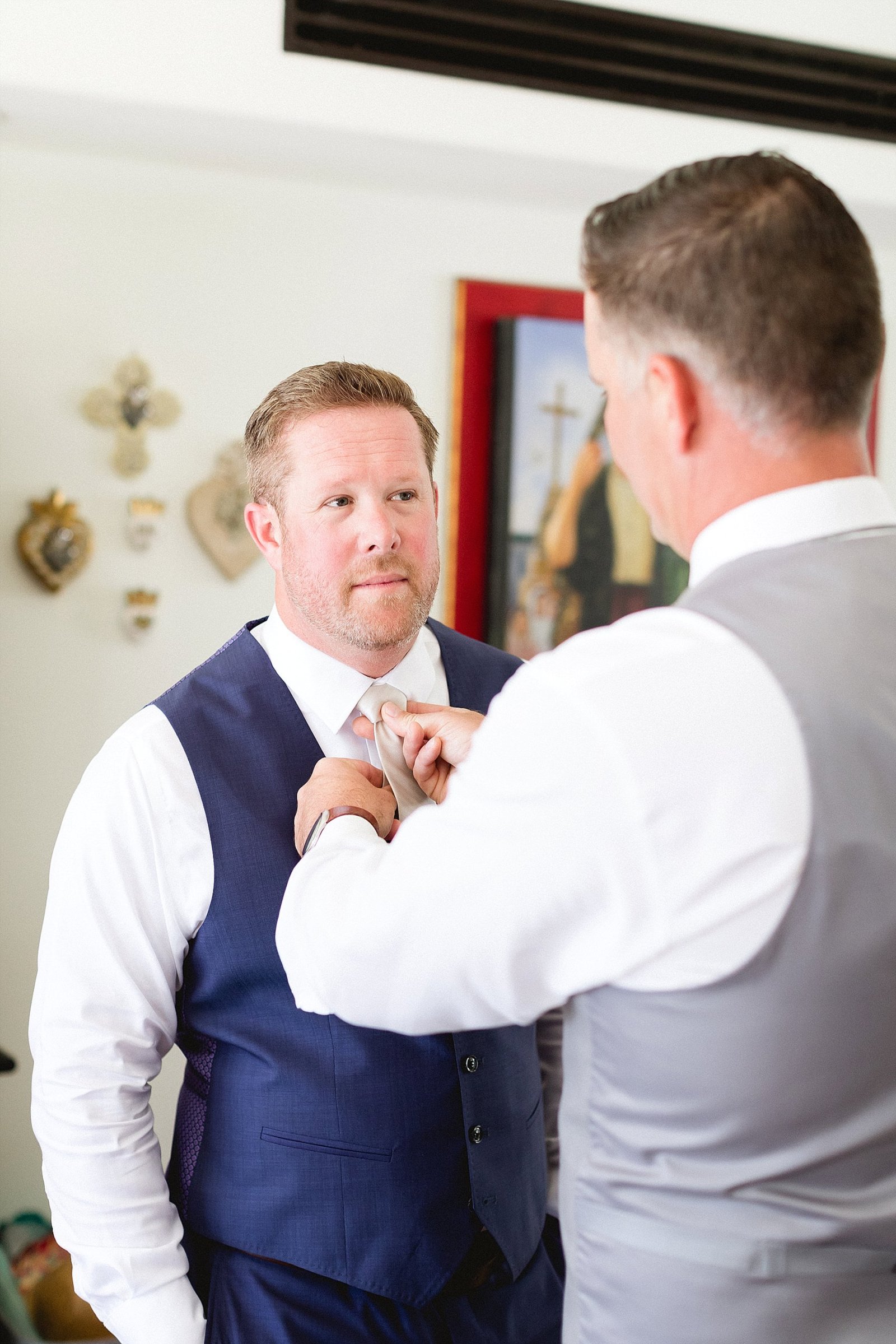 Groom getting ready at Hacienda Encantada in Cabo San Lucas Mexico, getting ready to head to his Wedding Venue at Flora Farms in Los Cabos, Mexico. Wedding Planning by Cabo Wedding Services and Photography by Sara Richardson,