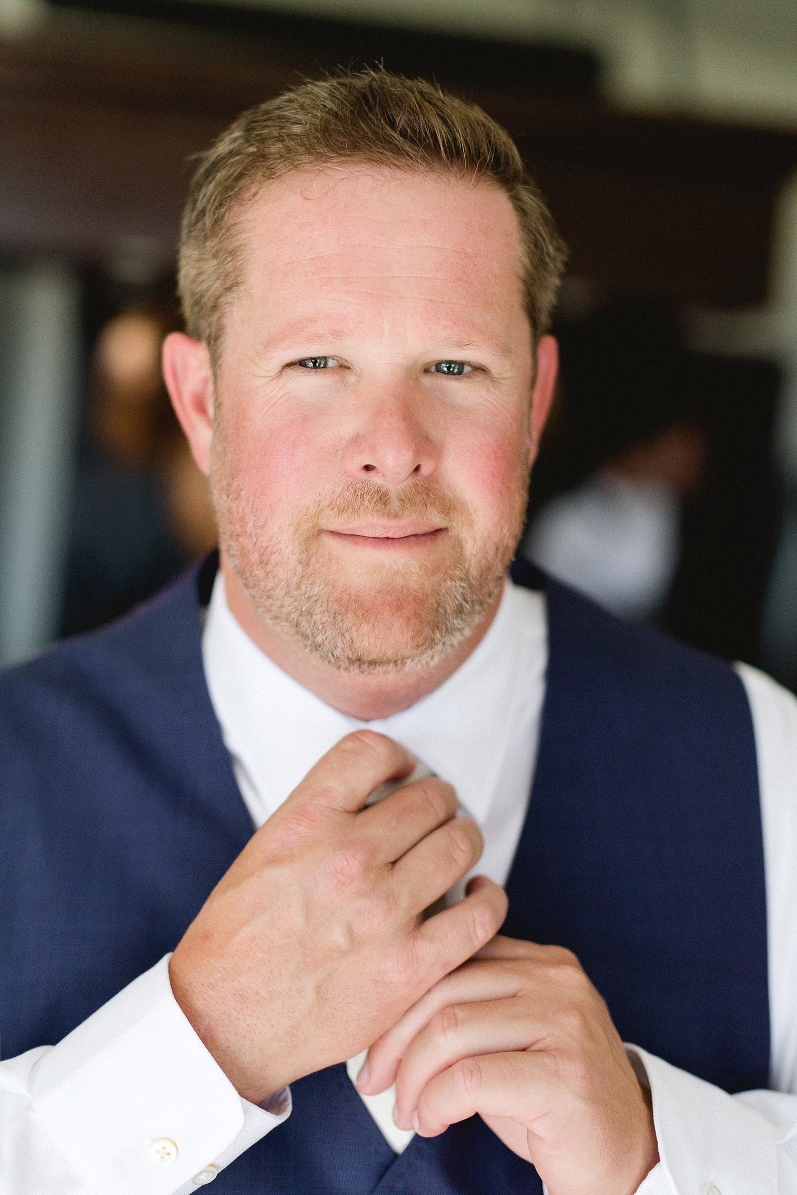 Groom posing for camera at hotel Hacienda Encantada in Cabo San Lucas, Mexico. He was about to head over to his Wedding Venue in San Jose, called Flora Farms. Wedding Planning by Cabo Wedding Services and Photography by Sara Richardson Photography