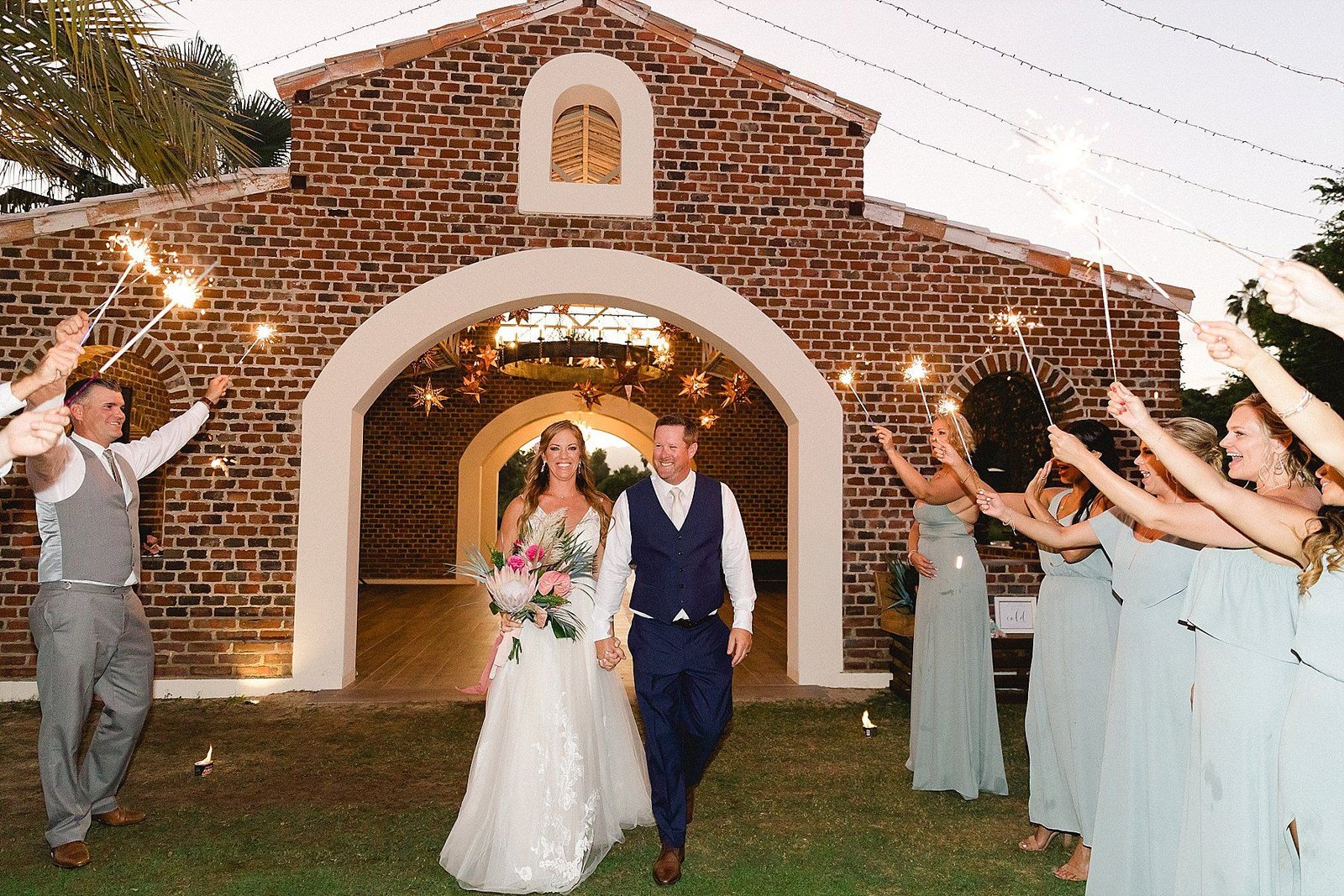 Bride and Groom doing their Grand Entrance to their Wedding Reception at Flora Farms, in Cabo San Lucas, Mexico. Wedding Planning by Cabo Wedding Services, Photography by Sara Richardson