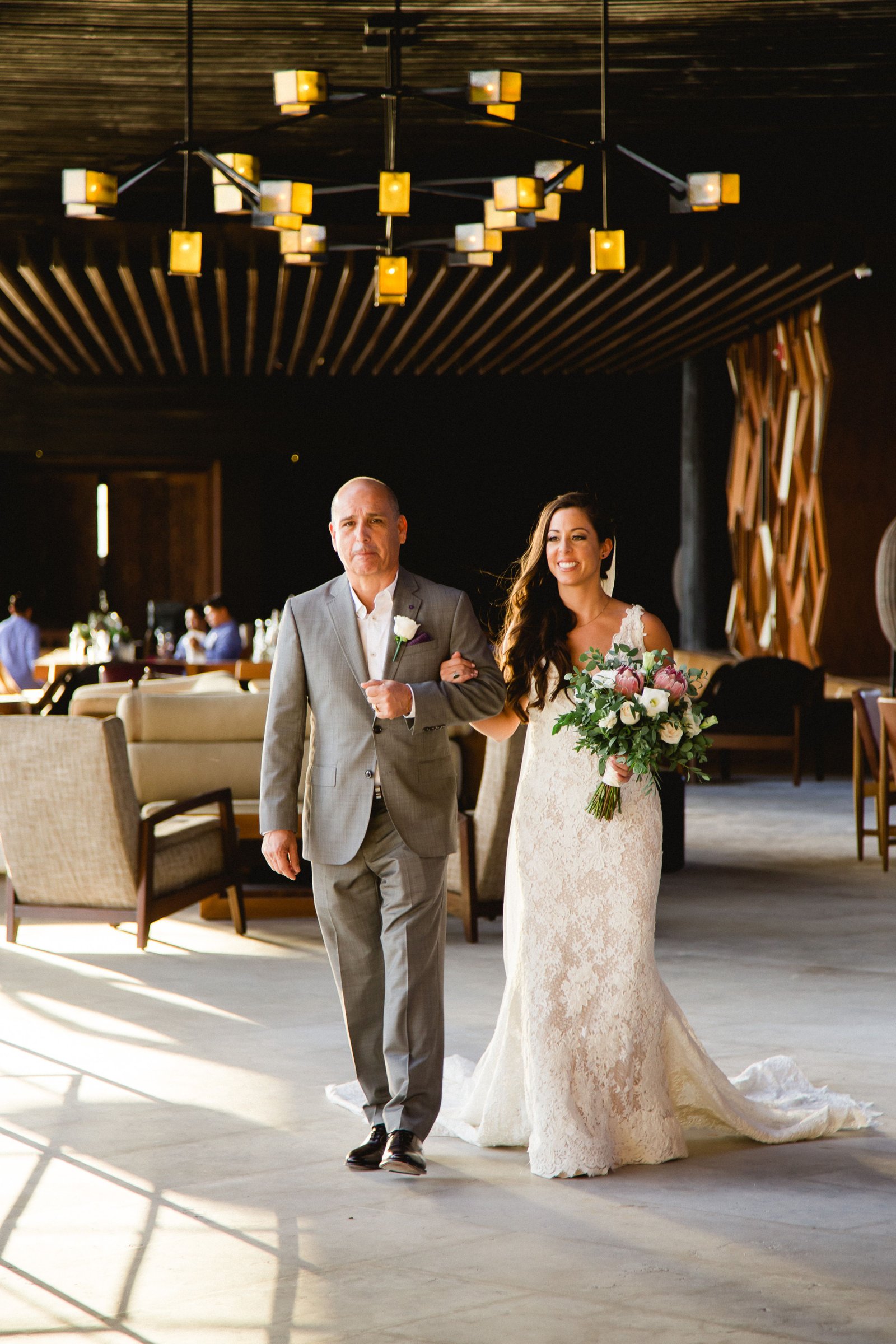 Bride walking down with her Father to the Ceremony at The Cape, in Los Cabos, Mexico. Wedding Planning was done by Jesse Wolff and Cabo Wedding Services