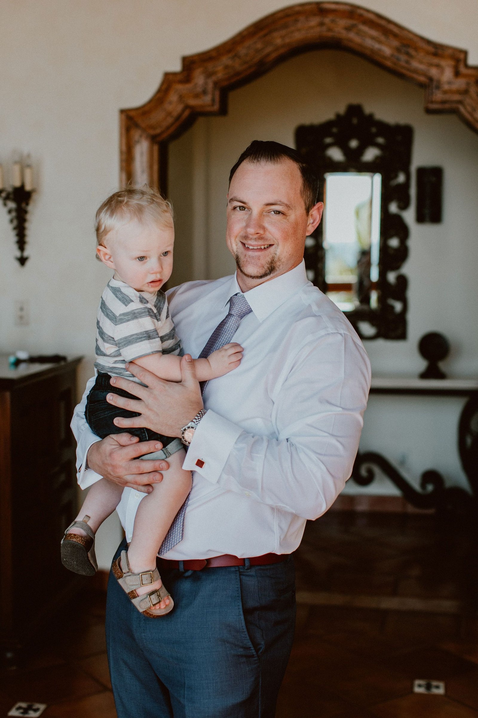 Groom with his son, Ryker, on his Wedding day in Los Cabos, Mexico. Destination Wedding Planner Cabo Wedding Services with Ana and Jerome Photography and Emporio Floral Art for Flowers. Design was done by Jesse Wolff from Cabo Wedding Services