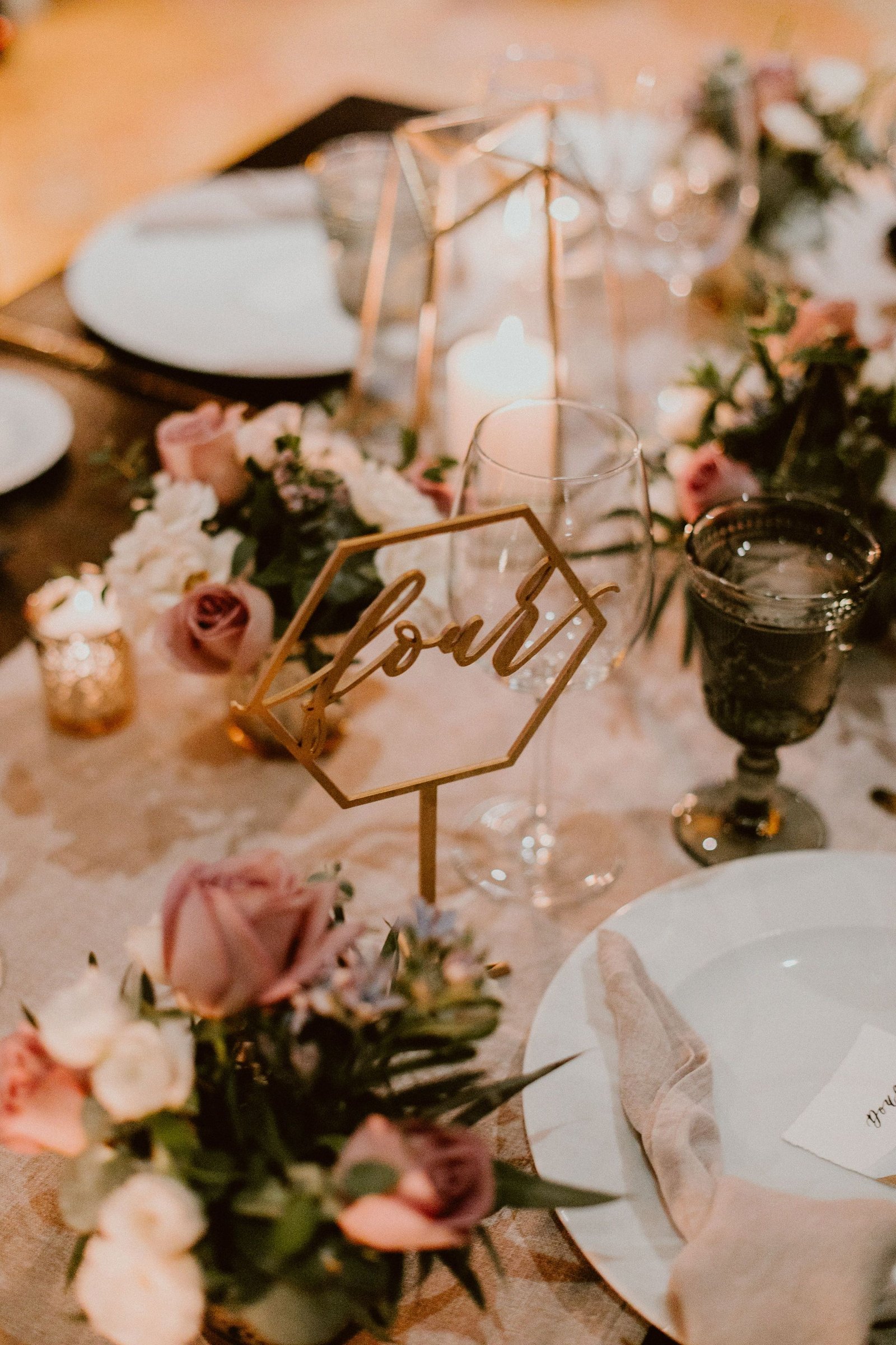 Table numbers made from wood where guests could find their names on the seating chart, then they had to find their table numnber.