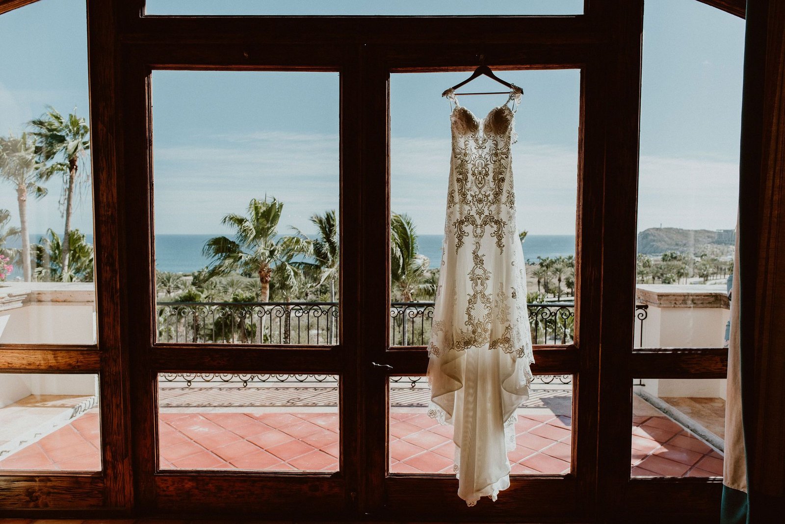 Bridal Dress hanging at Cabo del Sol for Destination Wedding in Los Cabos Mexico. Wedding Planning by Cabo Wedding Services. Wedding Photograohy by Ana and Jerome.  