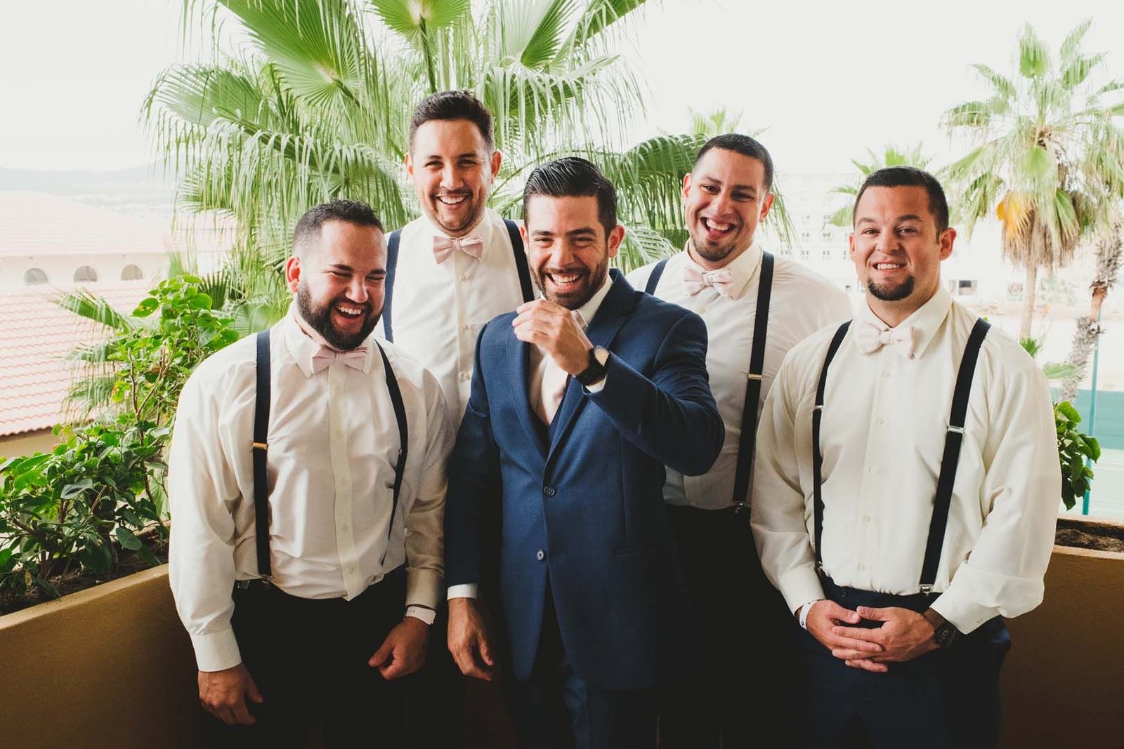 Groom getting a photo session before the wedding ceremony with his groomsmen. He was staying at Villa del Palmar in Los Cabos, Mexico.