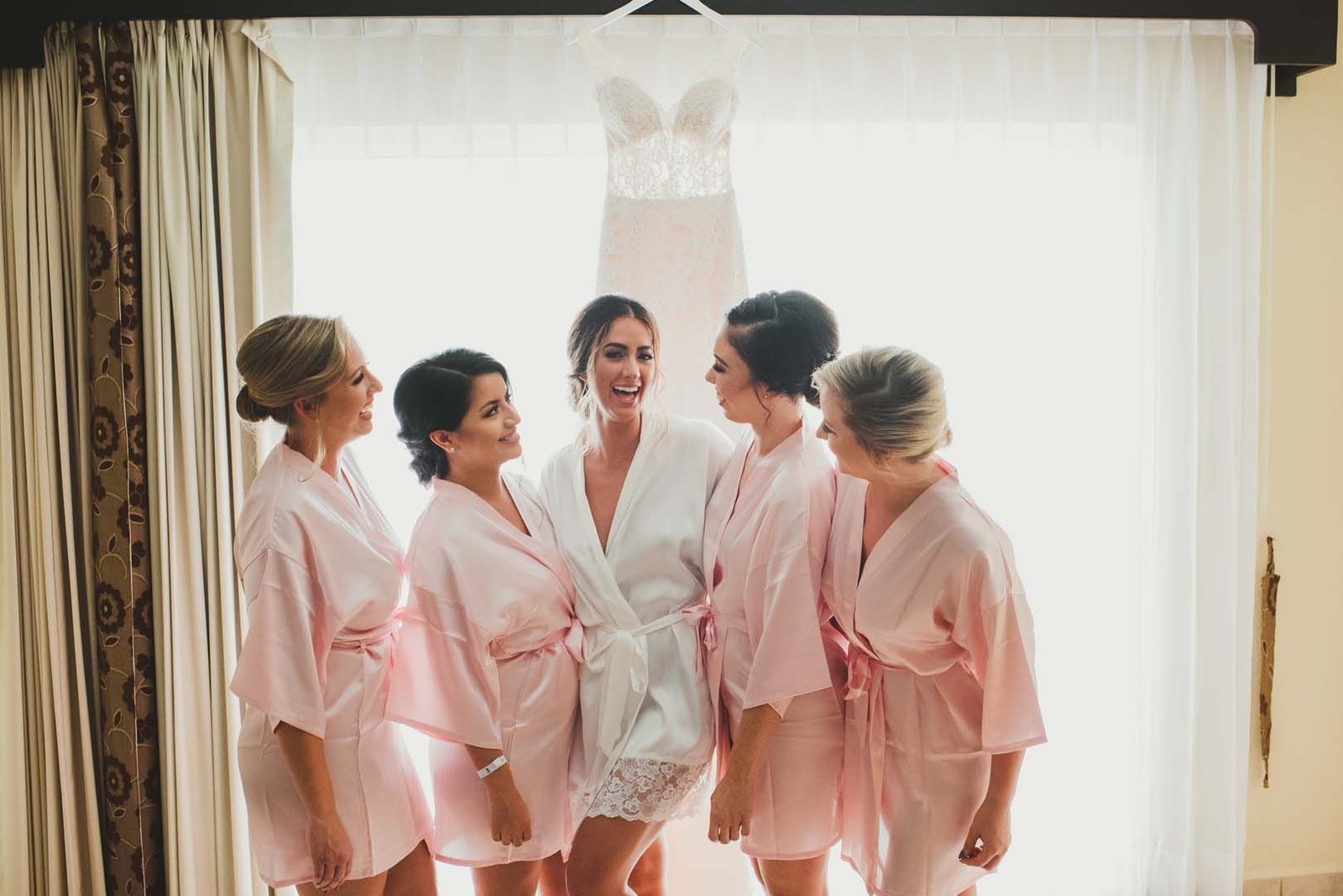 Bride hanging out with her Bridesmaids in the hotel room at Villa del Palmar in Los Cabos, Mexico.