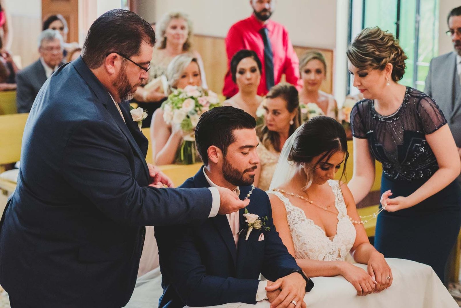 Bride and Groom getting their lazo done by the Groom's brother and Sister in Law. It was such a beautiful moment being able to witness something like this.