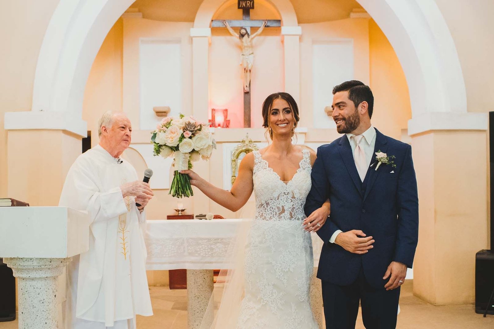 Bride and Groom just being pronounced Husband and Wife at the Evangelista Church. This wedding took place in Los Cabos Mexico. Wedding Planning by Cabo Wedding Services