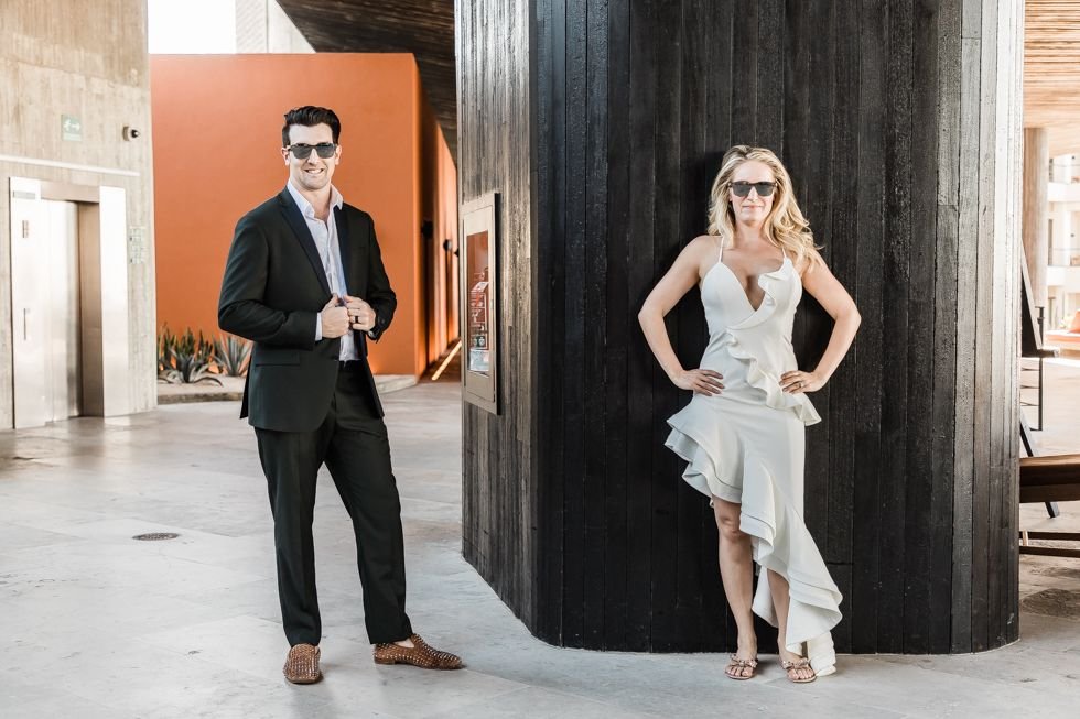 Bride and Groom posing for Photographer at The Cape in Los Cabos, Mexico. Destination Wedding Planning by Cabo Wedding Services. Photography by Daniel Jireh.