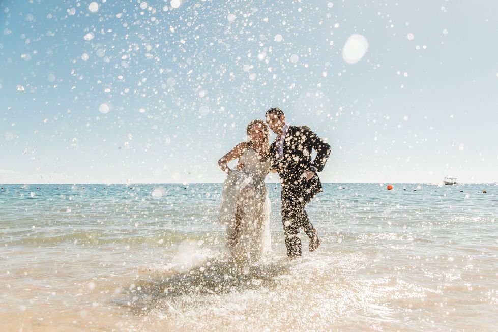 bride and Groom having fun during their trash the dress photo session at The Cape in Los Cabos Mexico. Wedding Planning was done by Jesse Wolff and Wedding Planning Company was done by Cabo Wedding Services. This photo session was done by local photographer Daniel Jireh, from Daniel Jireh Photography