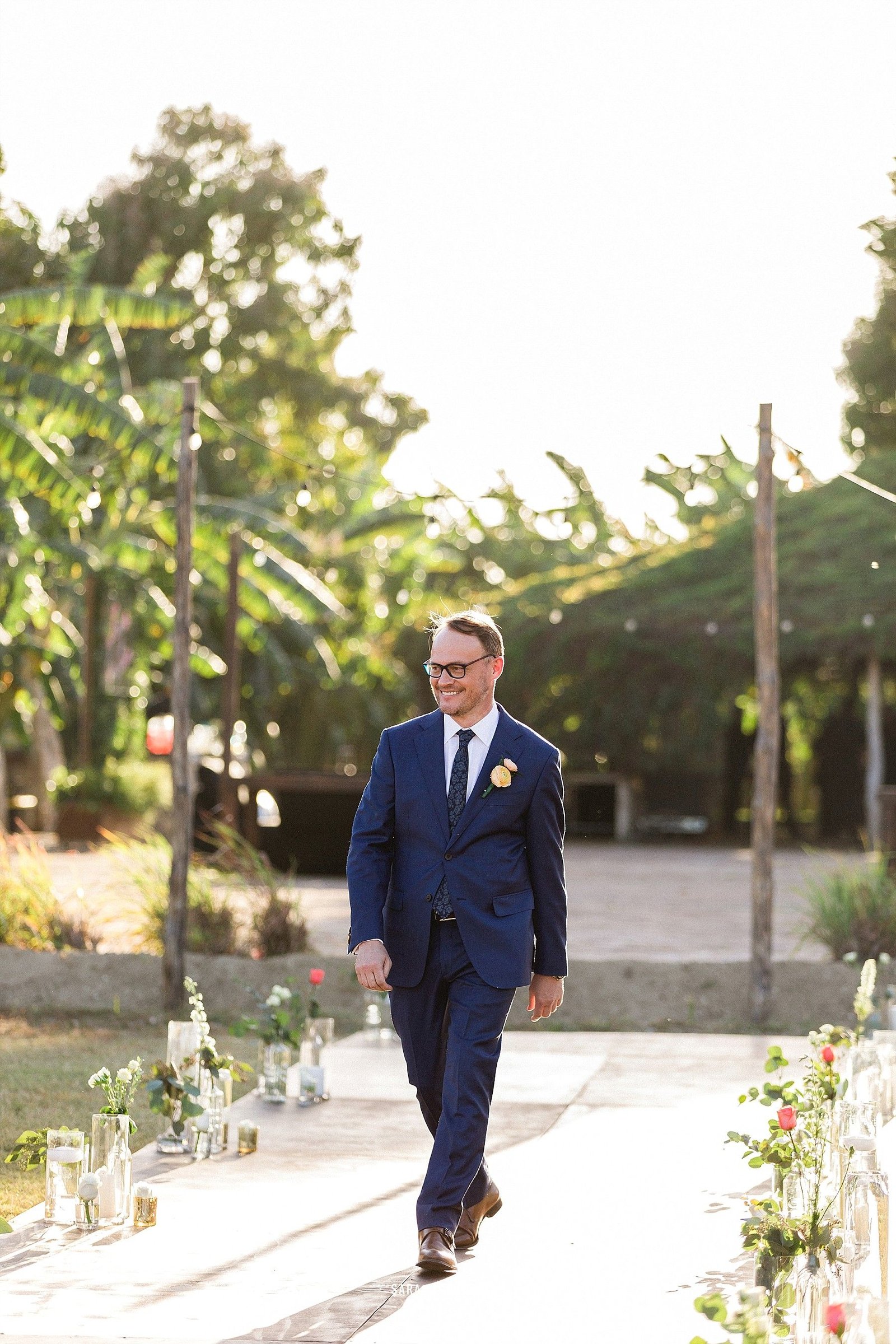 The groom walking down the aisle for his Wedding ceremony. 