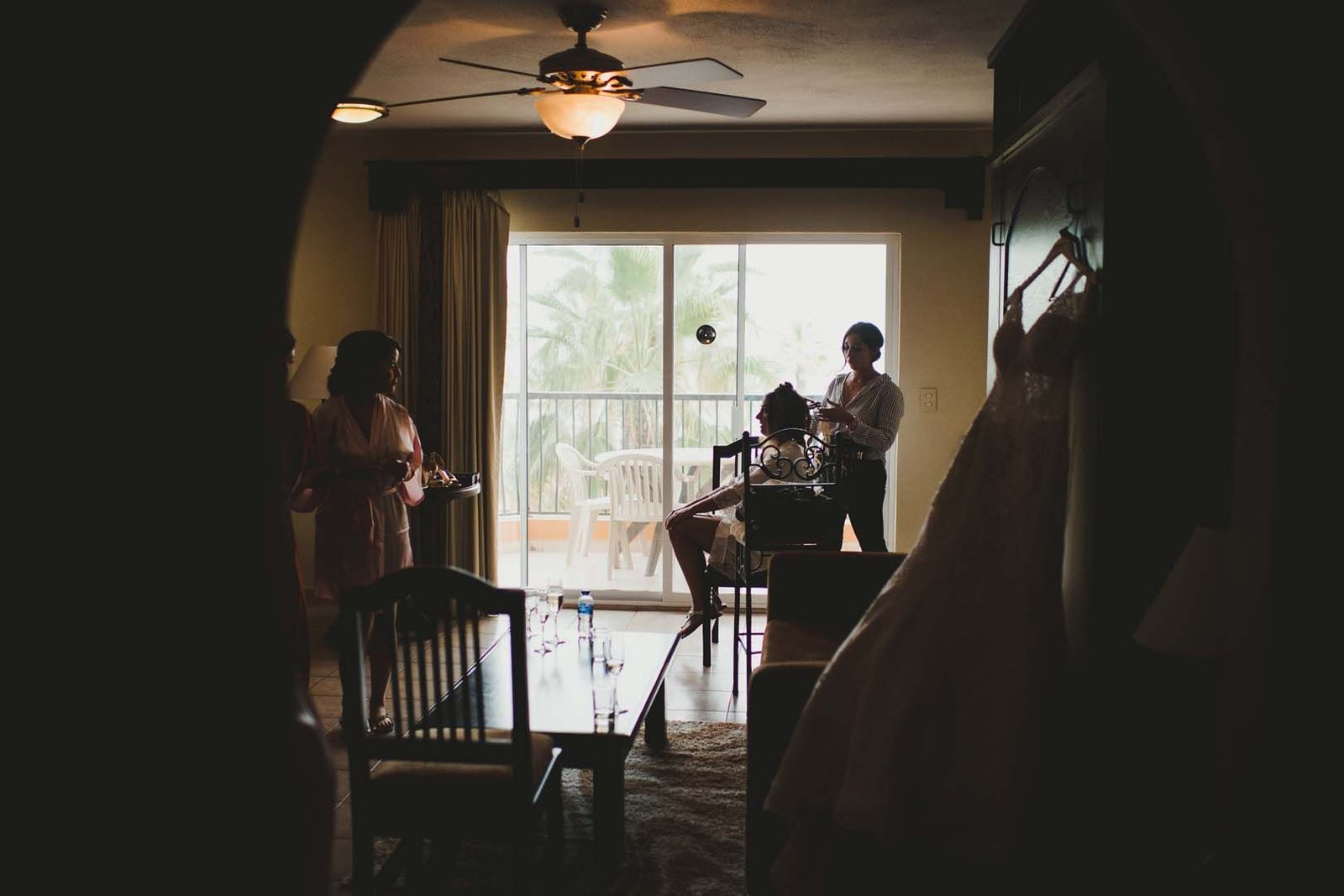 Paparazi shot of Bride getting her Hair + Makeup on her Wedding Day by Bri Berliner. She was getting ready in her hotel room at Villa del Palmar, in Los Cabos, Mexico.