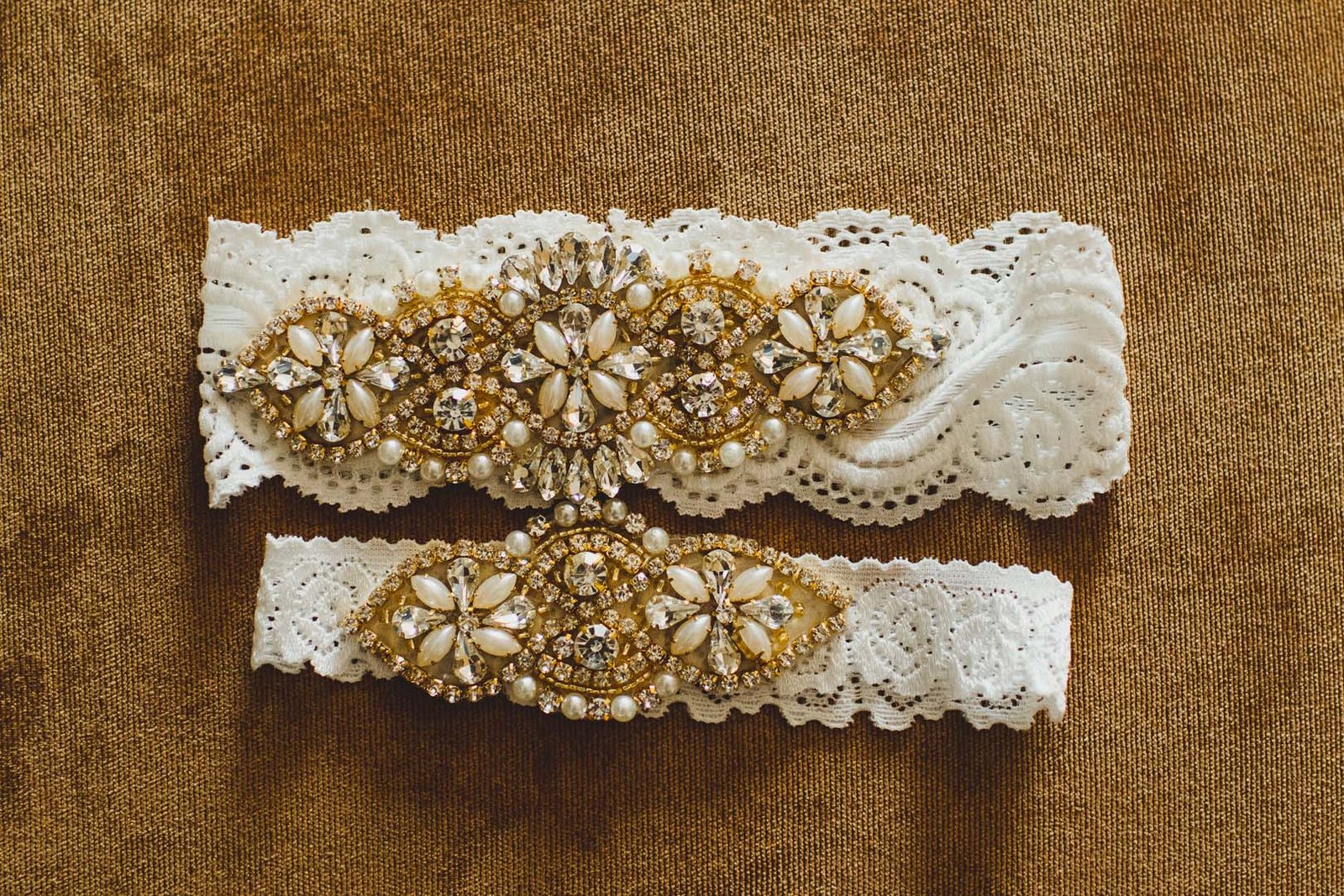 Photo Session of brides details before her wedding ceremony. This was the garter she was wearing before the garter toss. The wedding took place at Villa del Palmar, in Los Cabos, Mexico. Wedding Planning was done by Cabo Wedding Services.