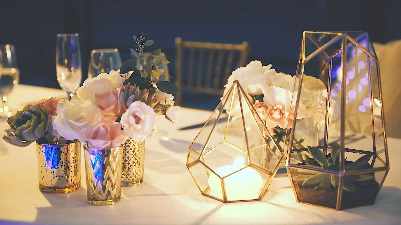 Geometric touches to the tables with roses, succulents and beautiful candle light,