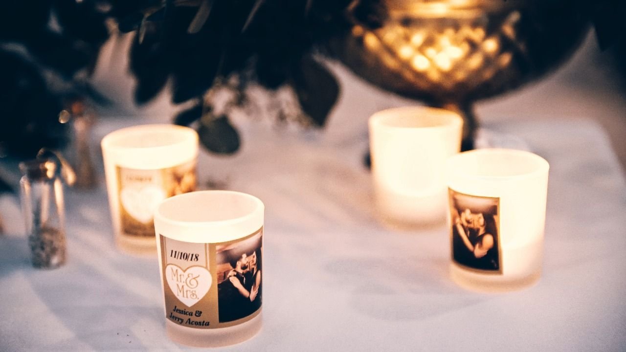 The Bride and Groom gave away little candle votives with their photo on them and they were the guests wedding favors and it also lit up the table so beautifully.