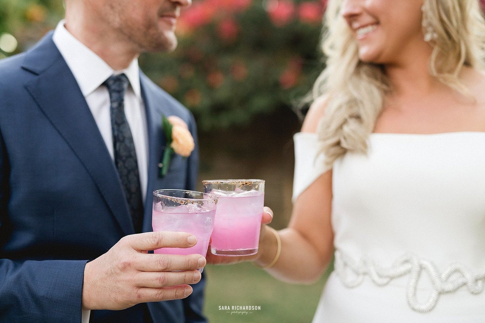 Bride and Groom cheering right after their ceremony. They did it! Destination weddings in Los Cabos Mexico