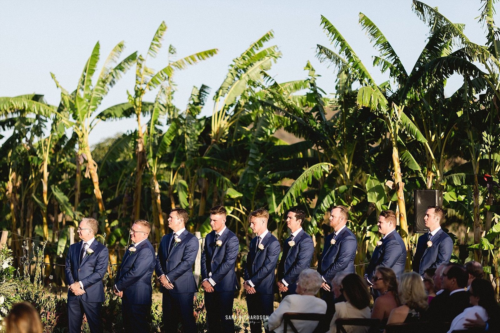 Groomsmen on the other side, getting the Groom's back as he says his personal vows to his future wife. Such an emotional moment!