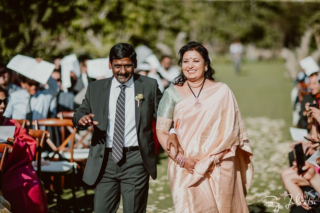 Father of the Bride and Mother of the Bride walked down the Aisle at Flora Farms, before their daughter entered the Ceremony. This was an Indian Ceremony that took place at Flora Farms, in Los Cabos Mexico. 