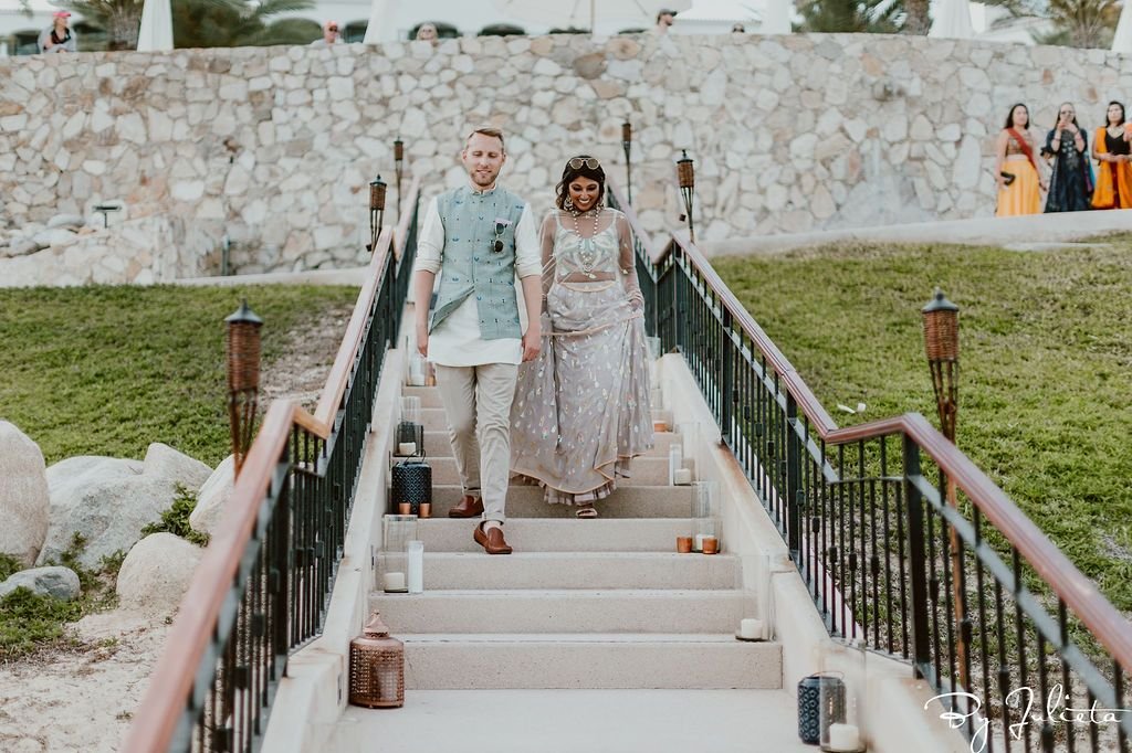 Bride and Groom walking into their Sangeet that took place at Hilton Los Cabos, in Cabo San Lucas, Mexico.