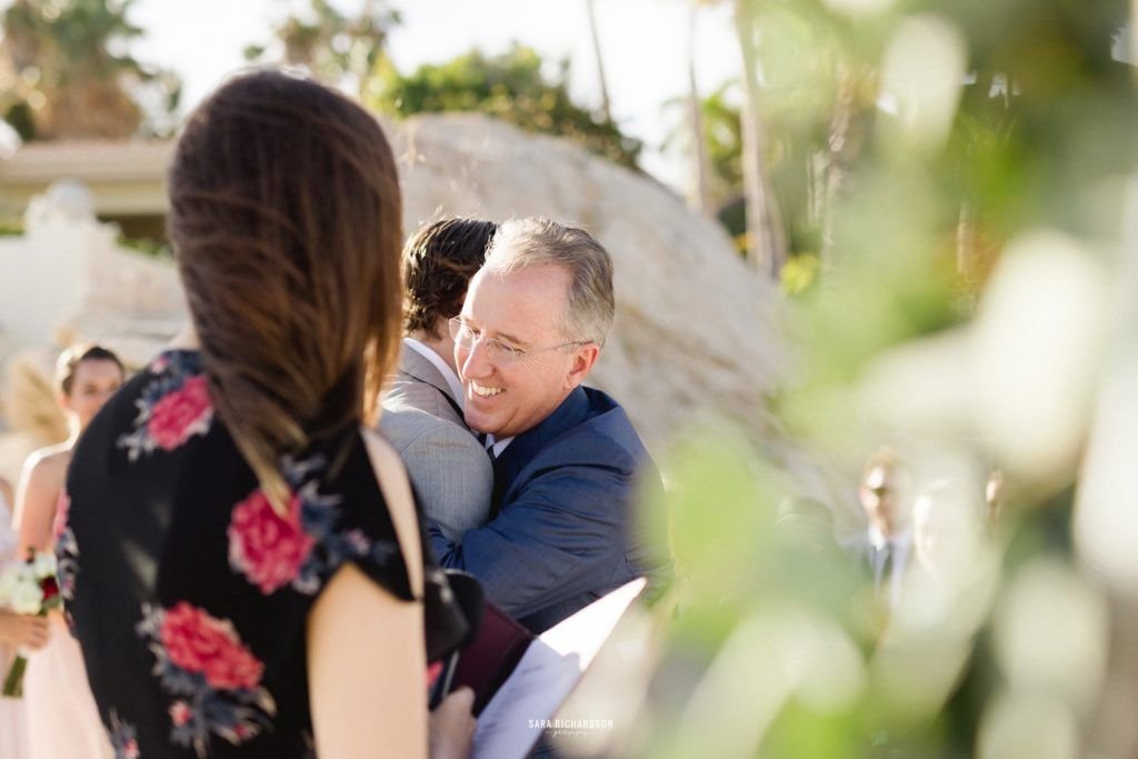 Father of Bride hugging the groom at their Destination Wedding Ceremony. It was perfect.