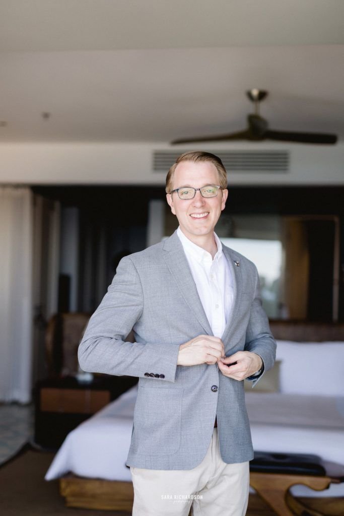 Groom getting ready right before his wedding at The Cape in Los Cabos Mexico.