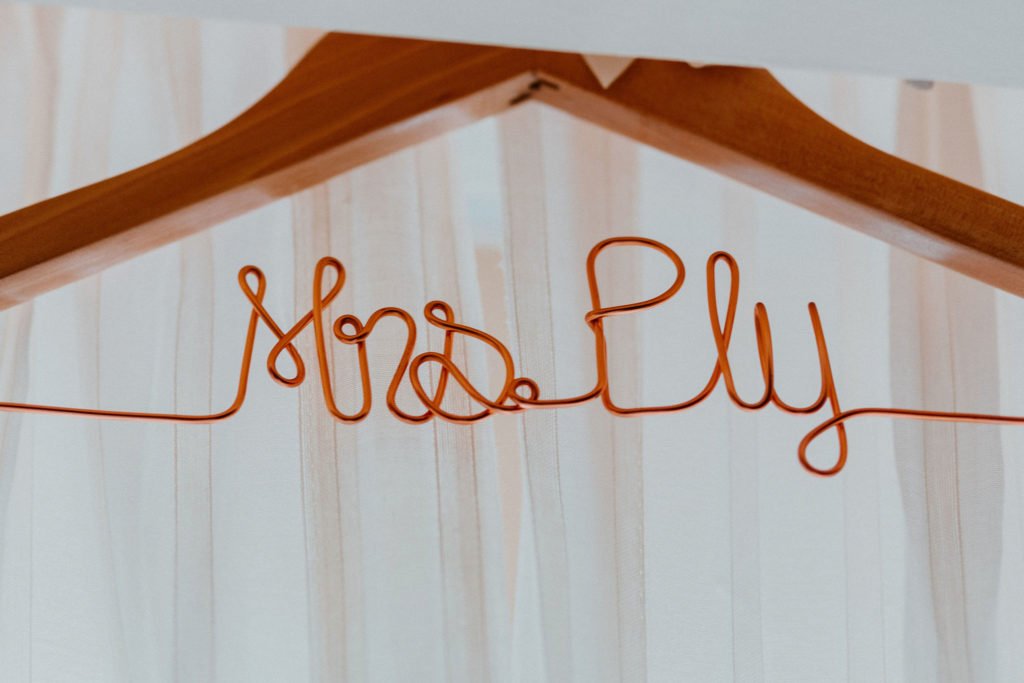 Brides hanger at her hotel room at Pueblo Bonito Sunset Beach. She decided to get it personalized with her future last name. 