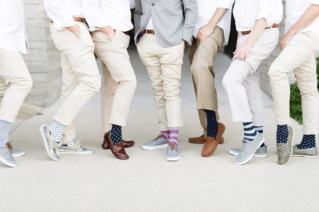 Groom with his Groomsmen showing of their Target socks. It is always super fun to get something that adds color for a photo session.