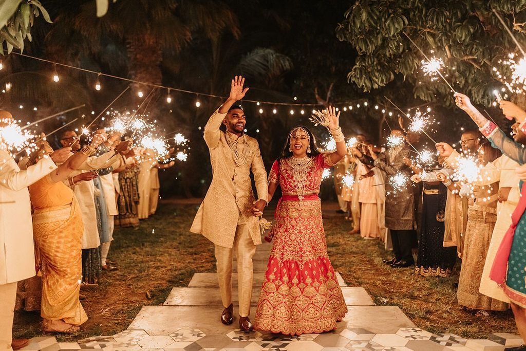 Bride and Groom leaving their wedding reception at the end of the night. Their guests gave them a great exit with handheld sparklers