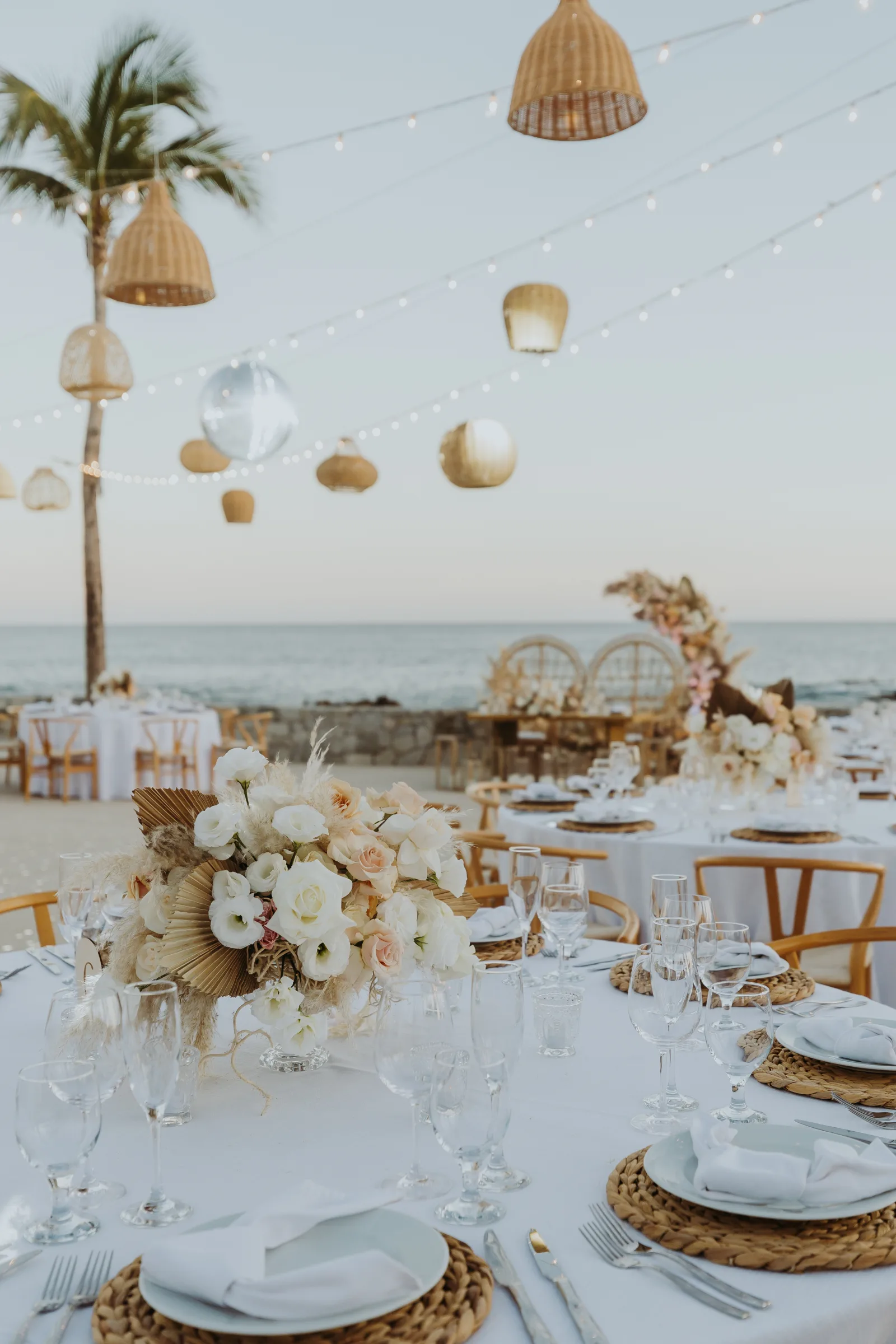 American couple exchanging vows at a beachfront Cabo wedding ceremony
