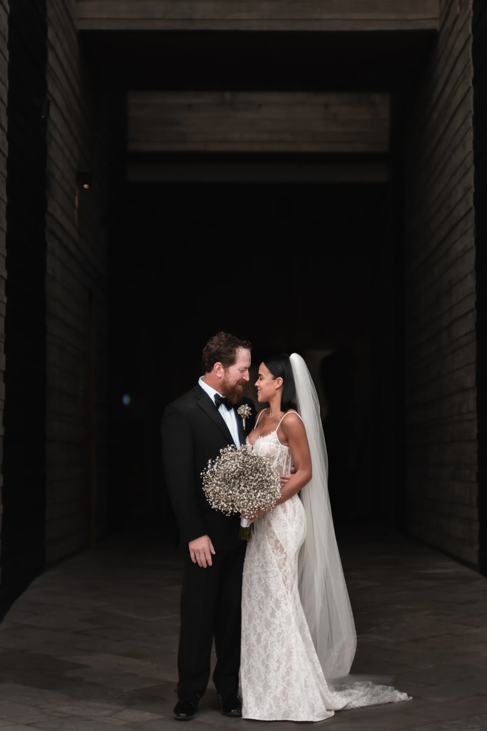 Newlyweds walking the aisle after their Cabo San Lucas wedding