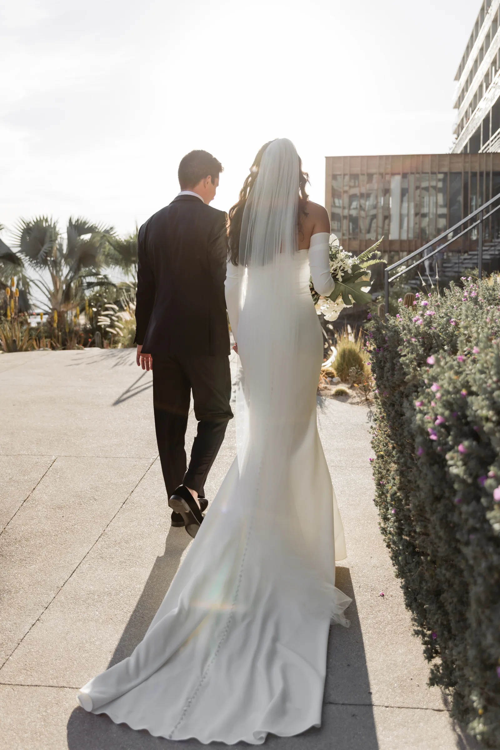 Couple walking together after their ceremony in Cabo
