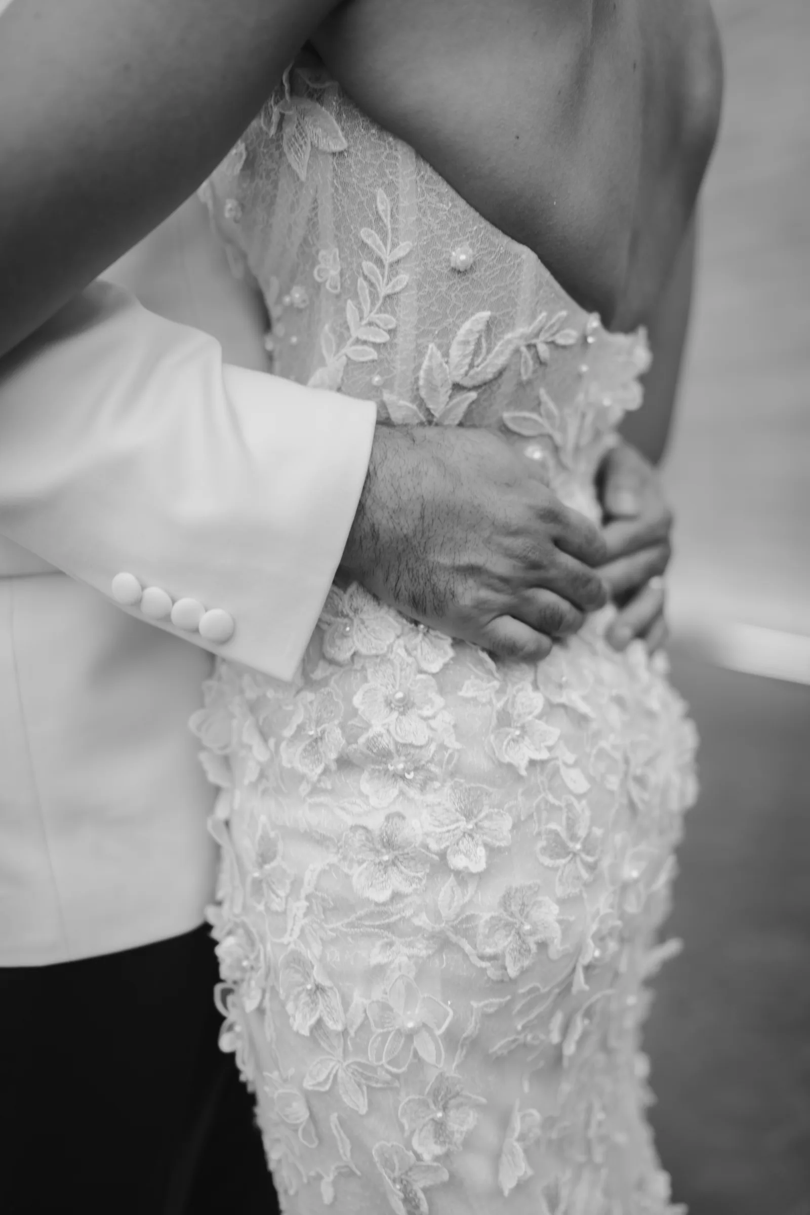 Close-up of a couple embracing after their ceremony
