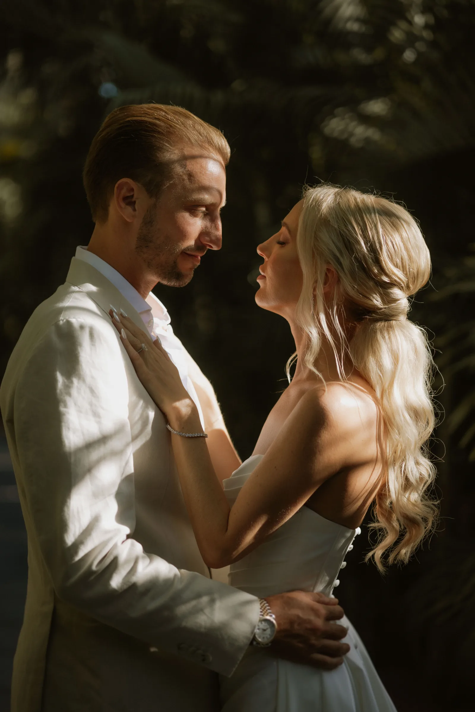 Newlyweds toasting at a Cabo destination wedding reception