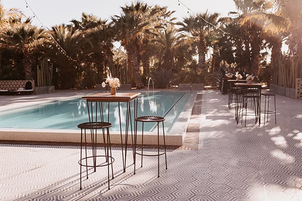 Acre Baja wedding setup in Cabo — pool area for guests