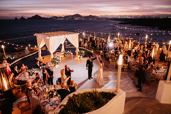 Sunset Monalisa wedding setup in Cabo San Lucas — dramatic cliffside venue