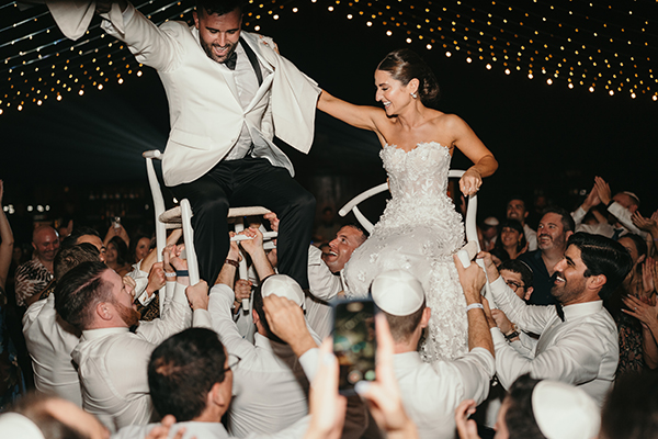 The Cape wedding setup in Cabo San Lucas — modern ceremony with Arch view